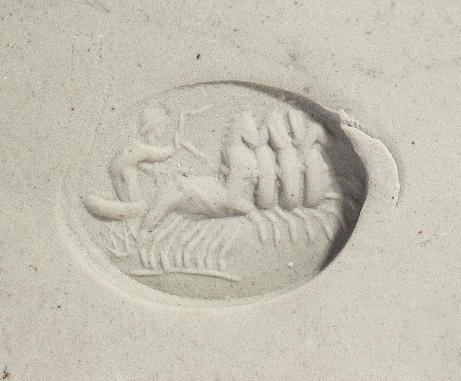 A Roman Carnelian Ring Stone with a Quadriga Chariot and Driver