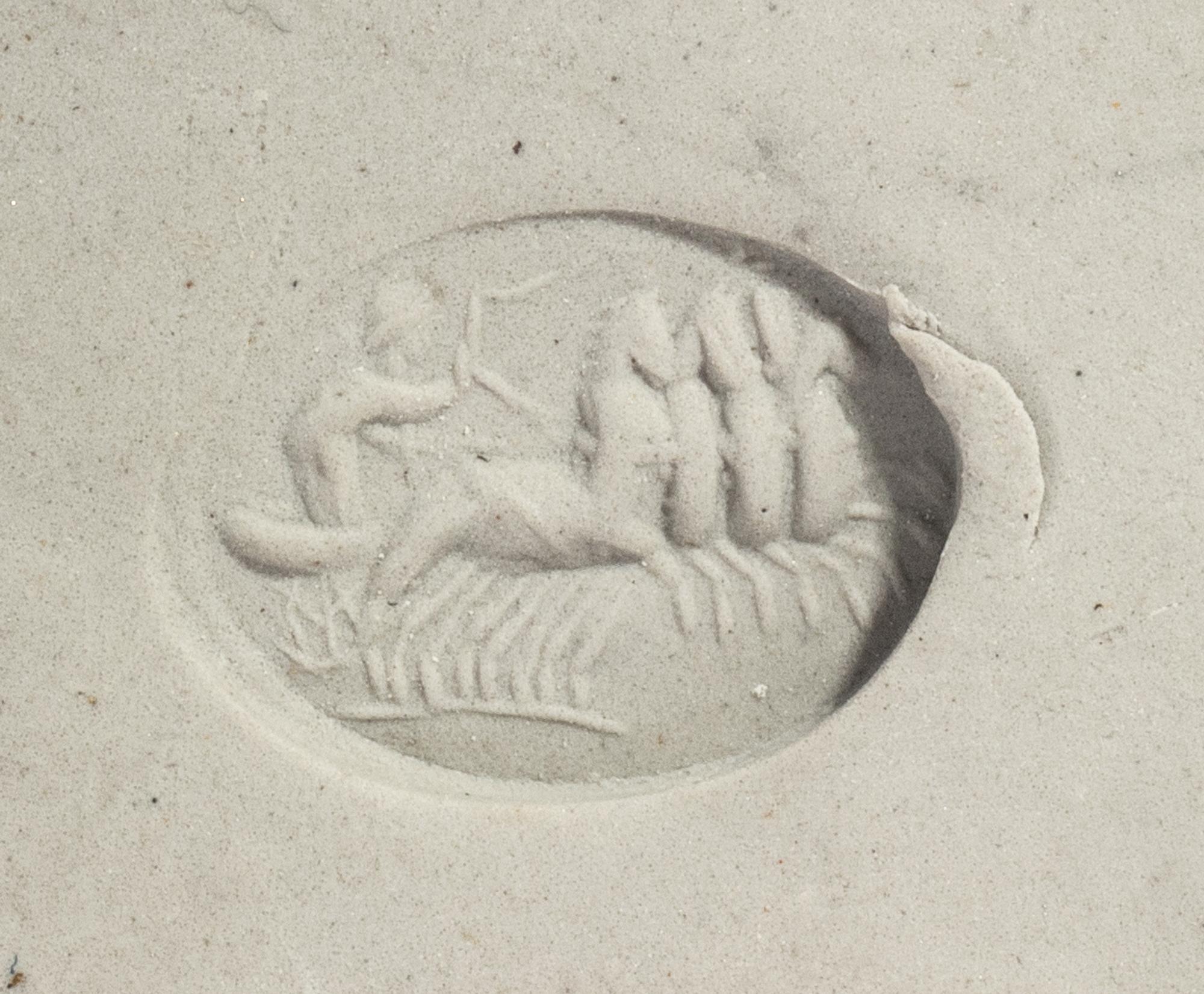 A Roman Carnelian Ring Stone with a Quadriga Chariot and Driver