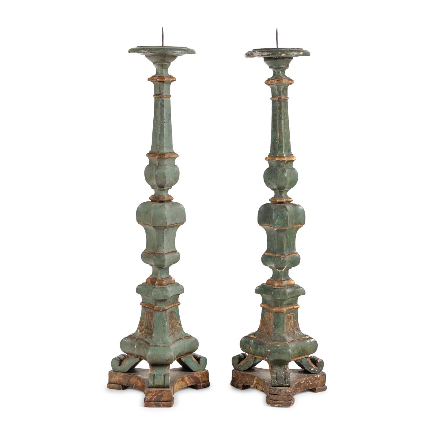 An Associated Pair of Italian Baroque Style Painted and Parcel Gilt Floor Prickets