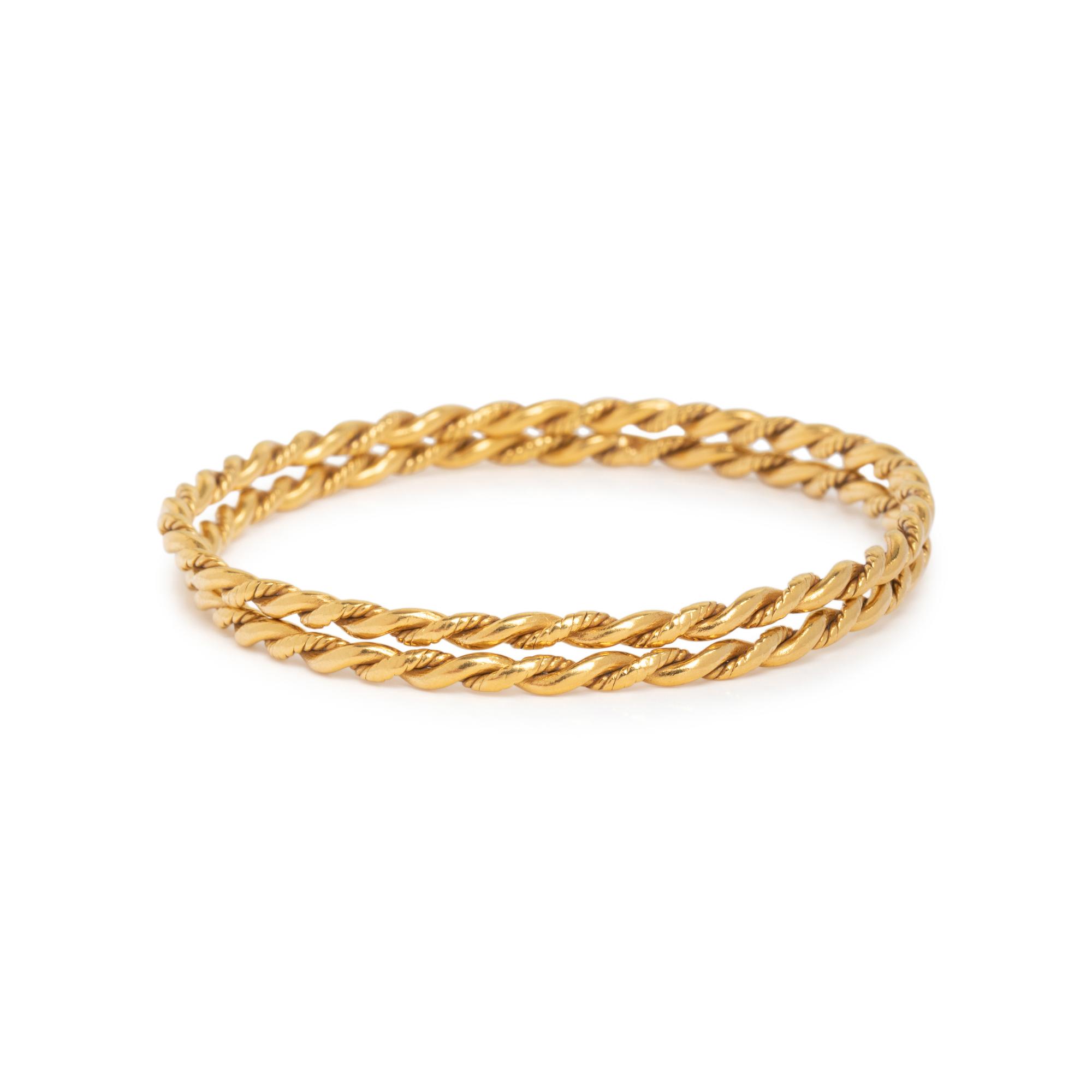 PAIR OF HIGH KARAT GOLD BANGLE BRACELETS