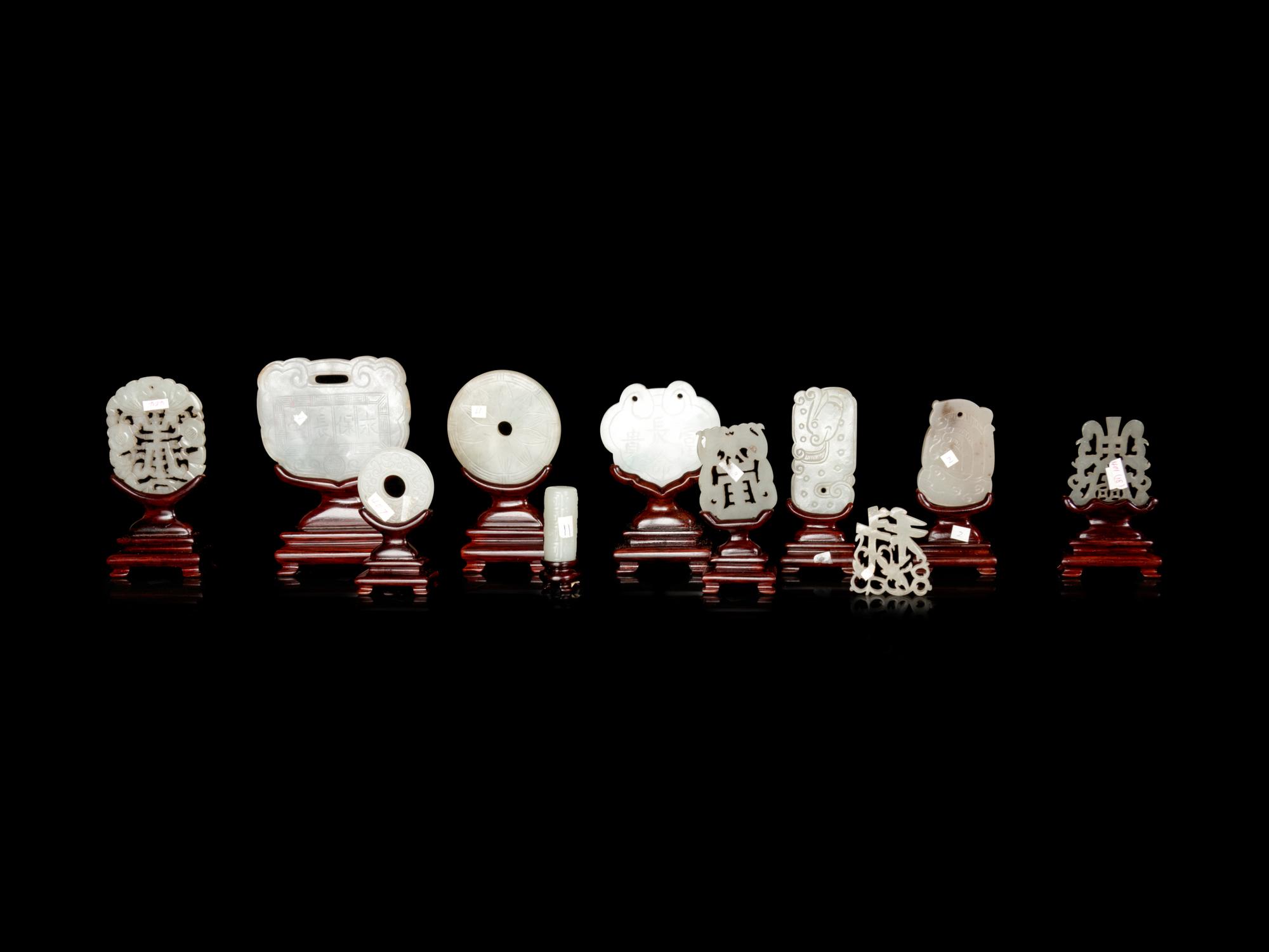 Eleven Chinese Carved and Reticulated Jade Plaques