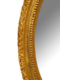 A George III Style Gilt Decorated Oval Mirror