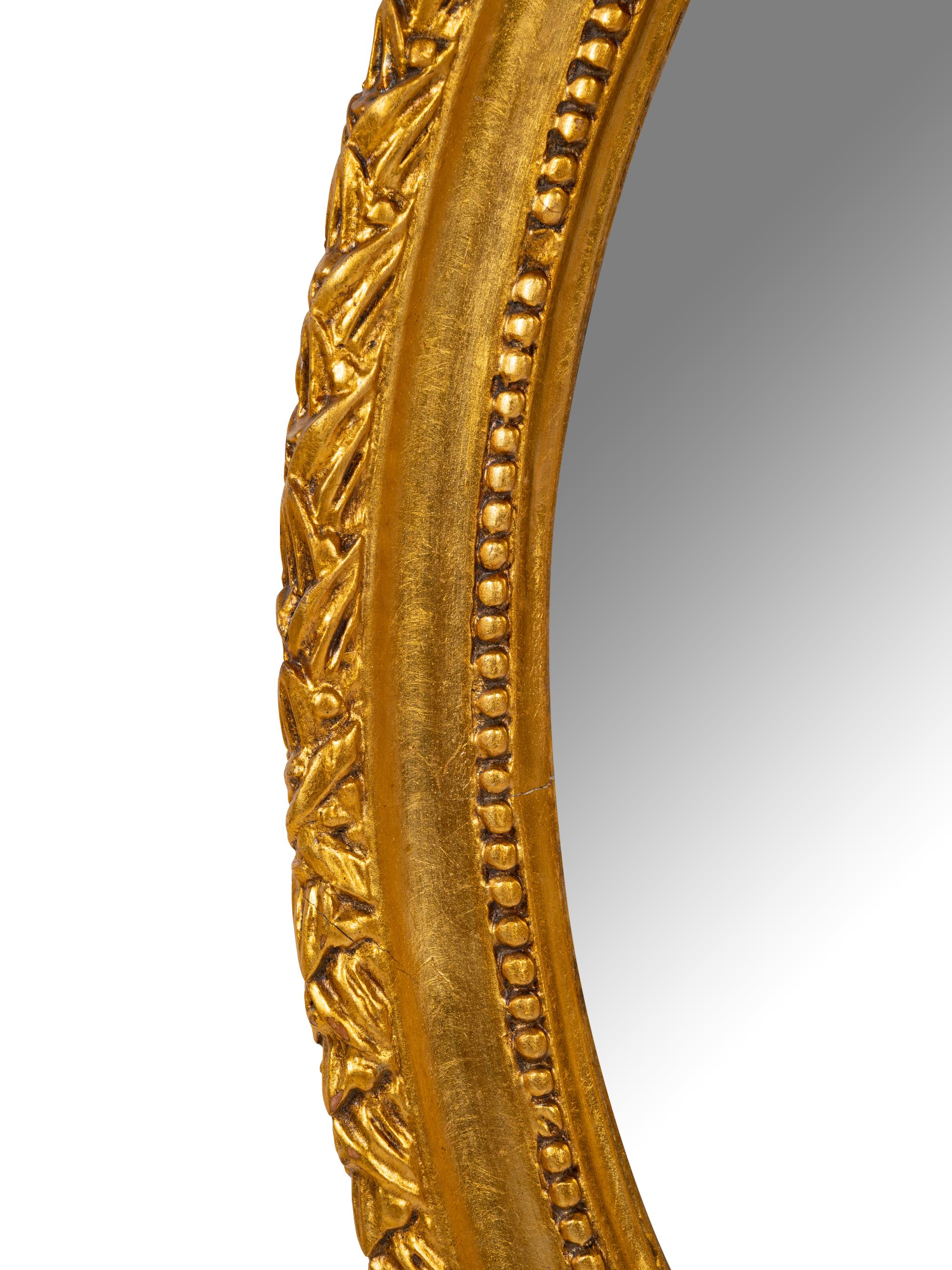 A George III Style Gilt Decorated Oval Mirror