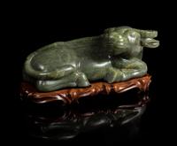 A Carved Spinach Jade Figure of a Water Buffalo — 19TH CENTURY