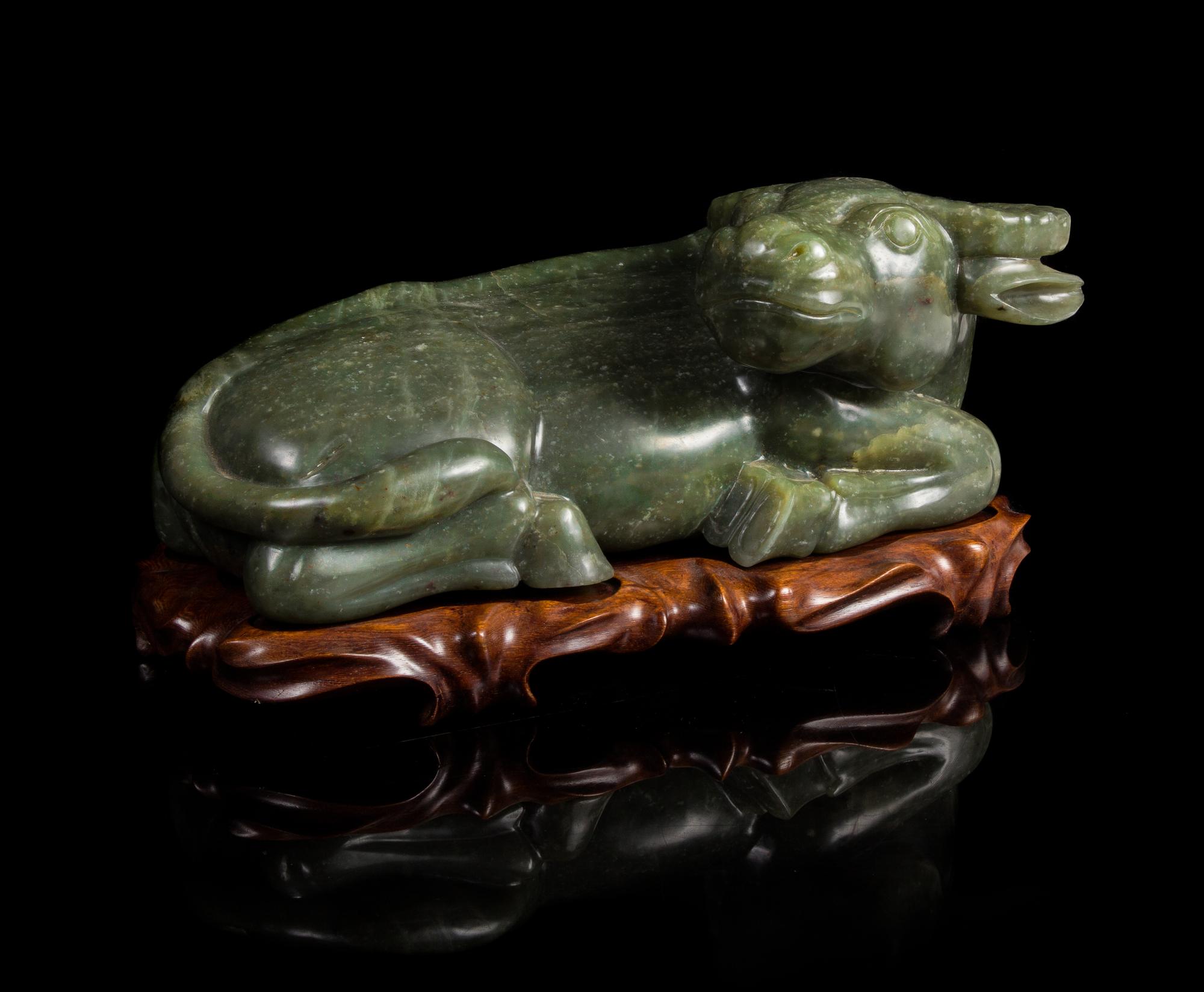 A Carved Spinach Jade Figure of a Water Buffalo — 19TH CENTURY