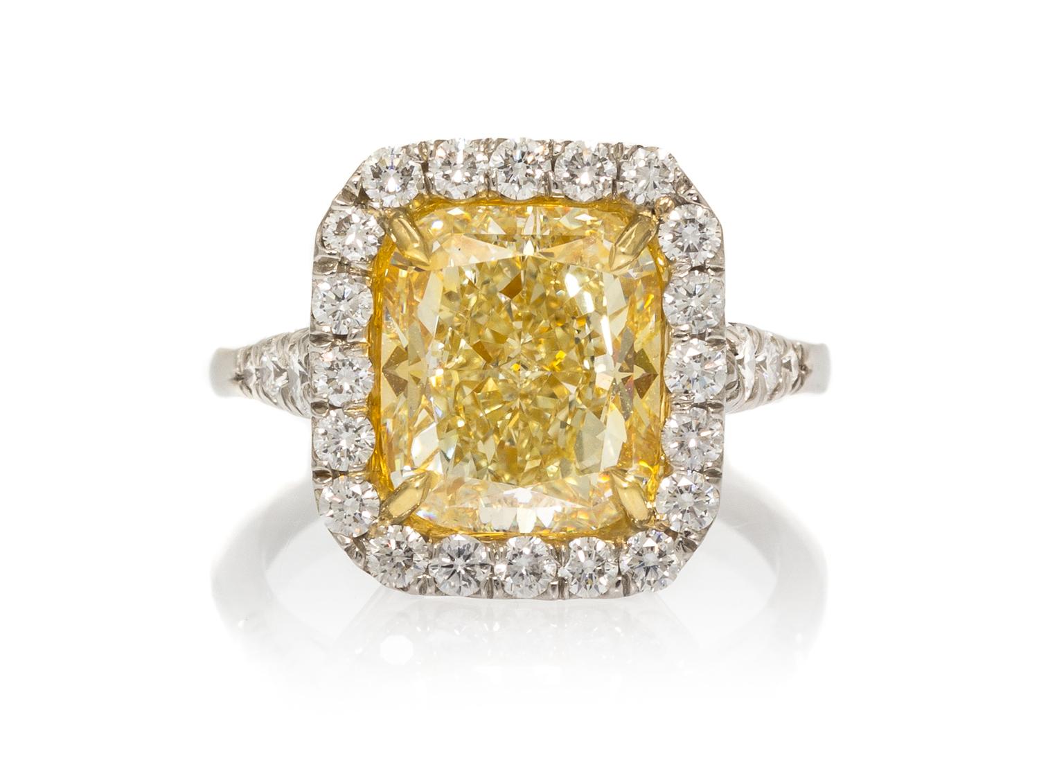 A Platinum, Yellow Gold, Fancy Intense Yellow Diamond and Diamond Ring, 5.60 dwts.
