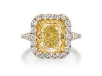 A Platinum, Yellow Gold, Fancy Intense Yellow Diamond and Diamond Ring, 5.60 dwts.