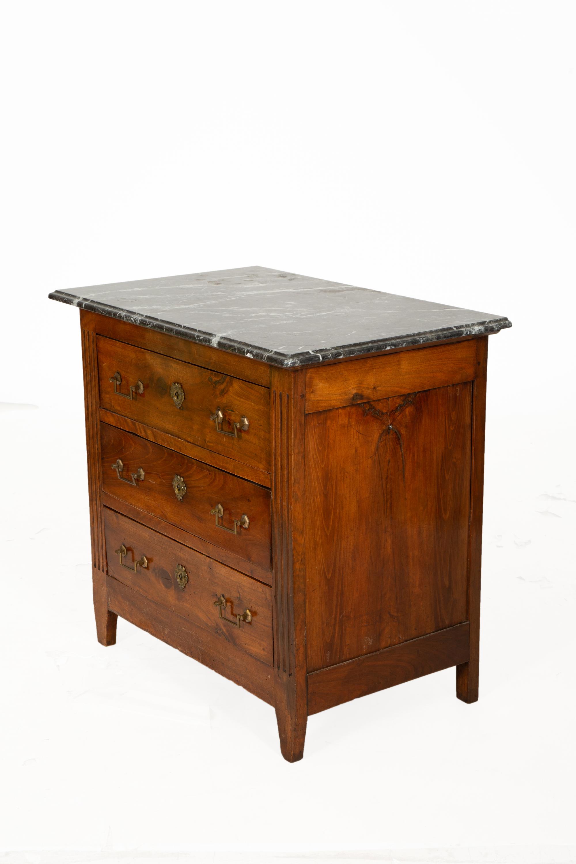 A German Walnut Four-Drawer Commode with Marble Top