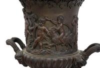 A Pair of Continental Bronze Urns with Associated Plinths