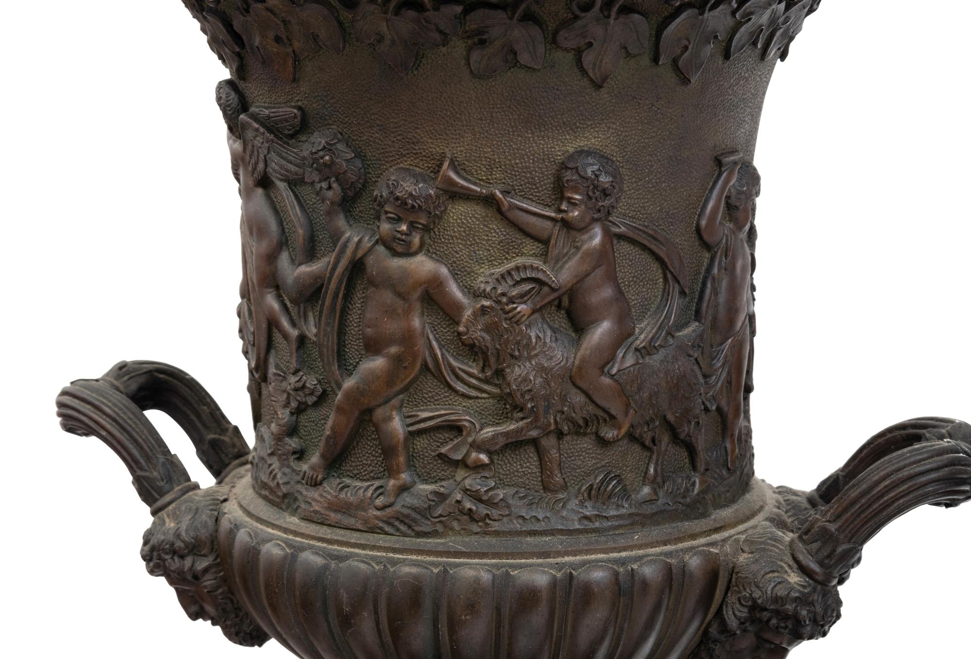 A Pair of Continental Bronze Urns with Associated Plinths