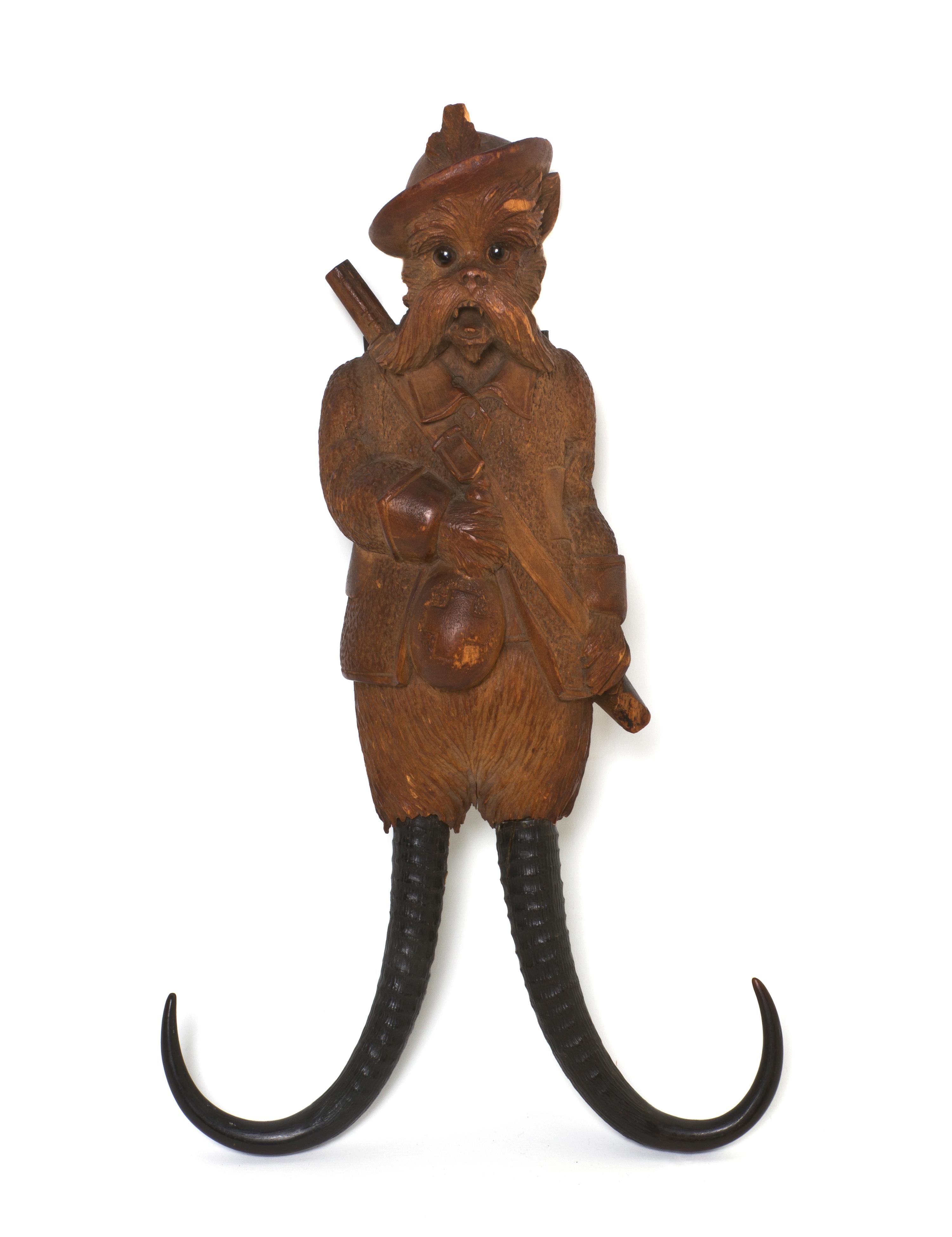 A Black Forest Carved Musical Coat Hook, Height 14 inches.