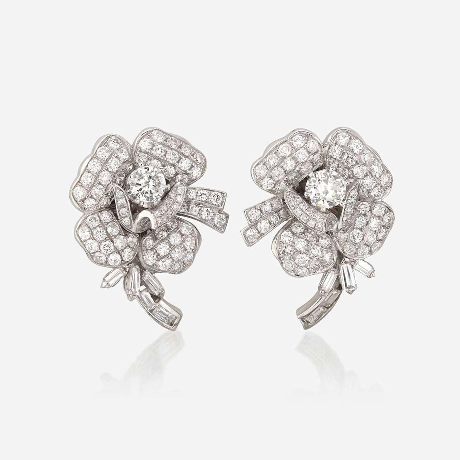 A pair of diamond and eighteen karat white gold earrings