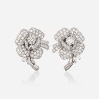 A pair of diamond and eighteen karat white gold earrings