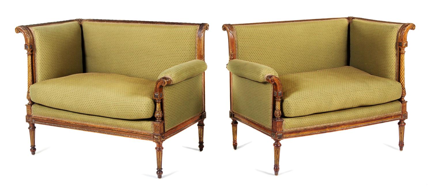 A Pair of Napoleon III Carved Walnut Settees First example: height 33 1/8 x width 43 x depth 24 1/2 inches. — CIRCA 1870