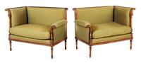A Pair of Napoleon III Carved Walnut Settees First example: height 33 1/8 x width 43 x depth 24 1/2 inches. — CIRCA 1870