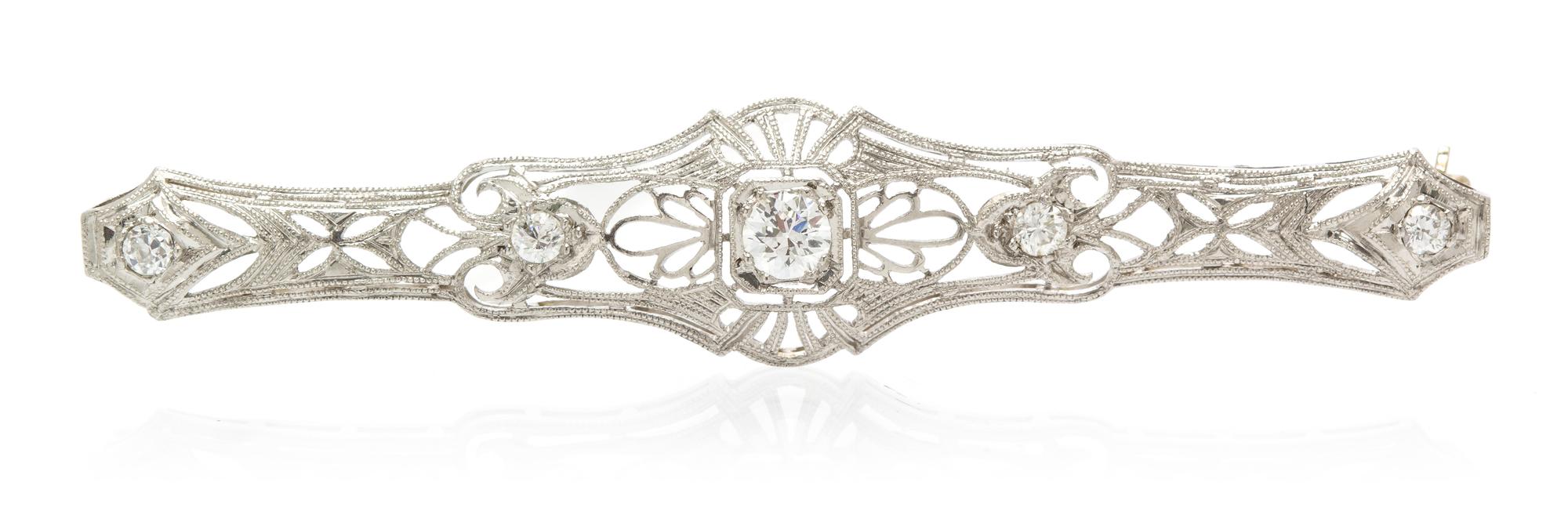 A Platinum, White Gold and Diamond Bar Brooch, 3.90 dwts.