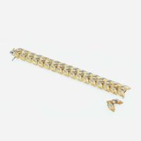 An 18K bicolor gold and diamond link bracelet
