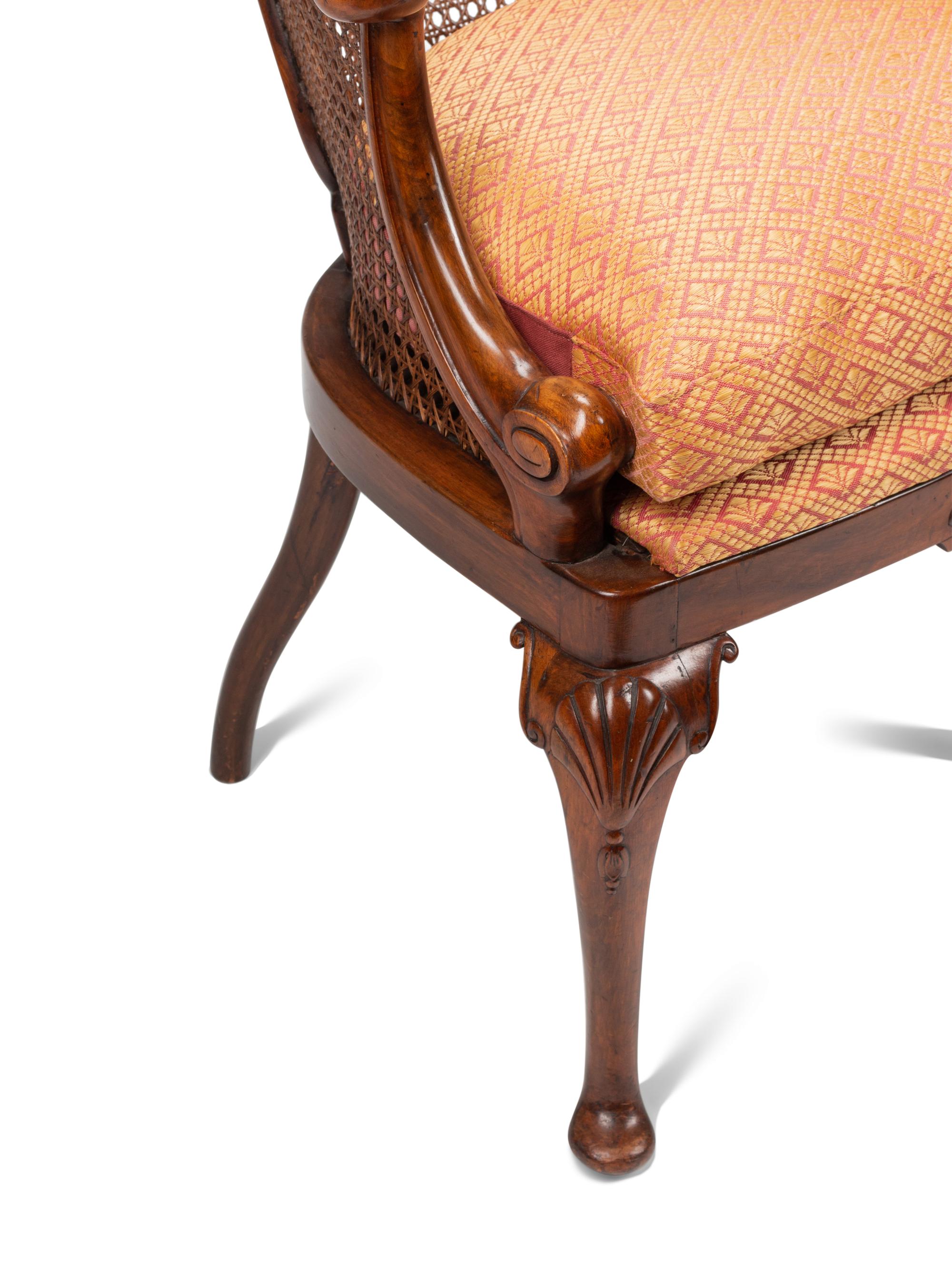 A Pair of English Walnut Barrel-Back Armchairs