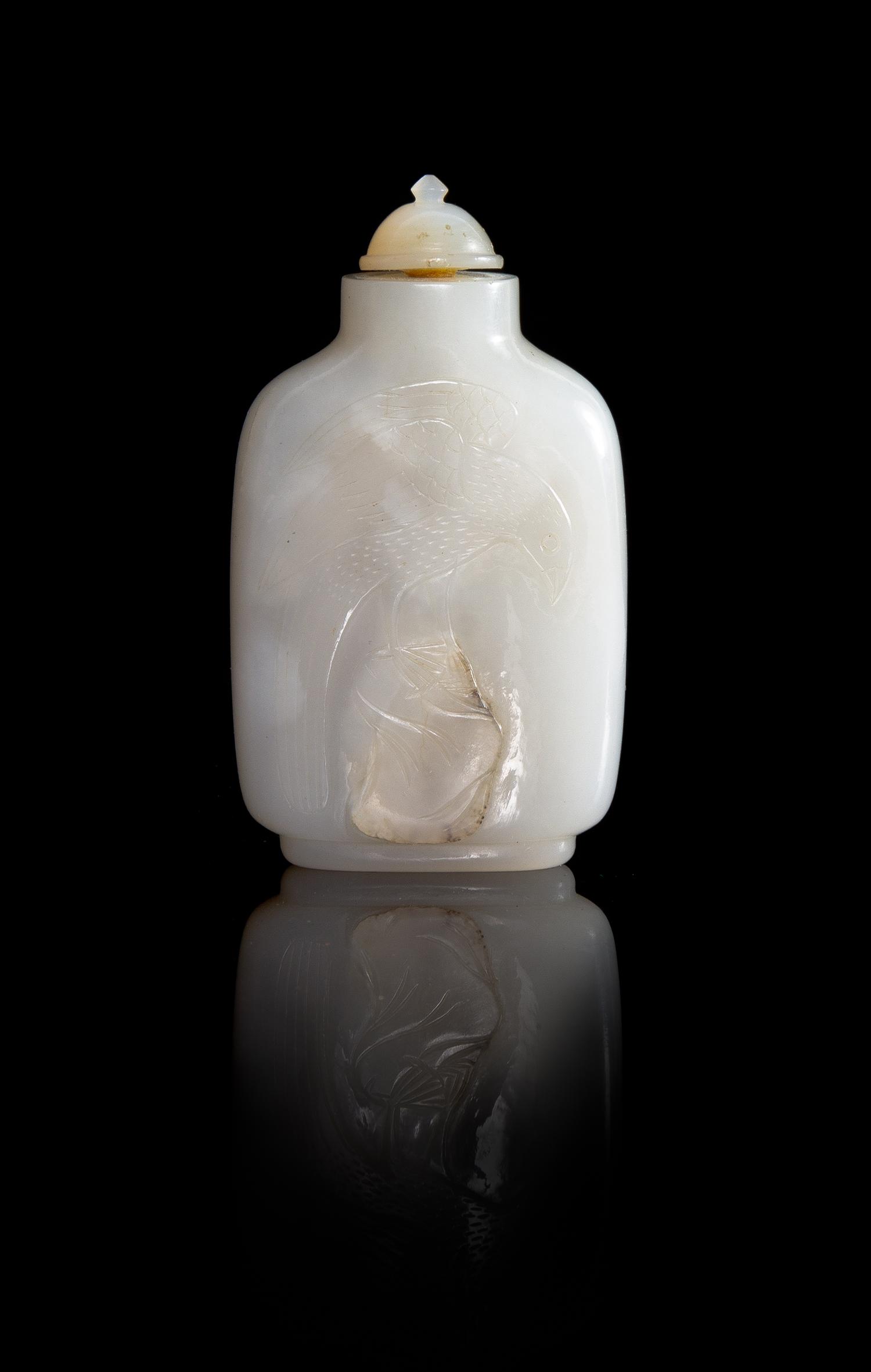 A Carved White Jade Snuff Bottle Height 3 inches.