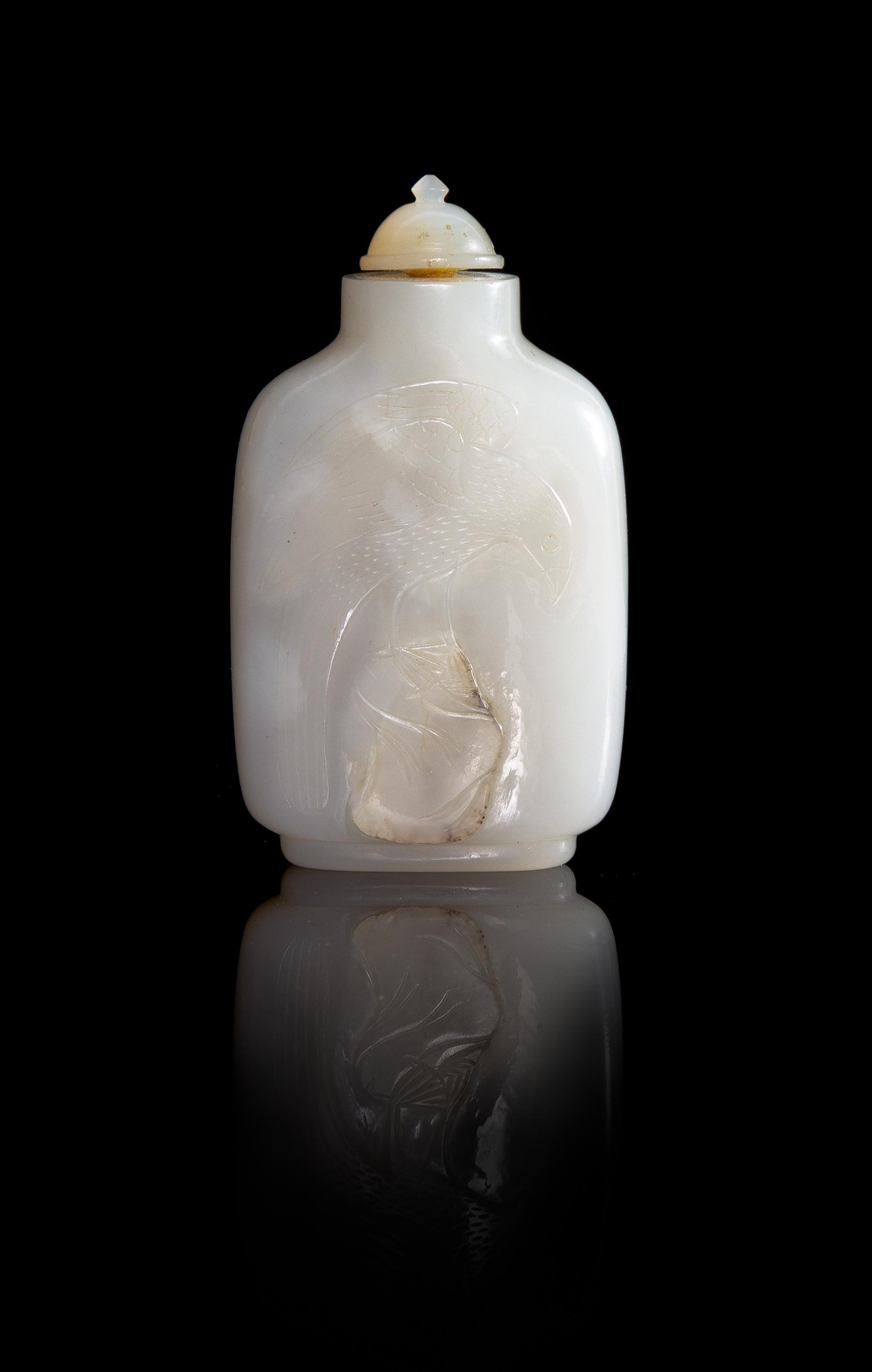 A Carved White Jade Snuff Bottle Height 3 inches.