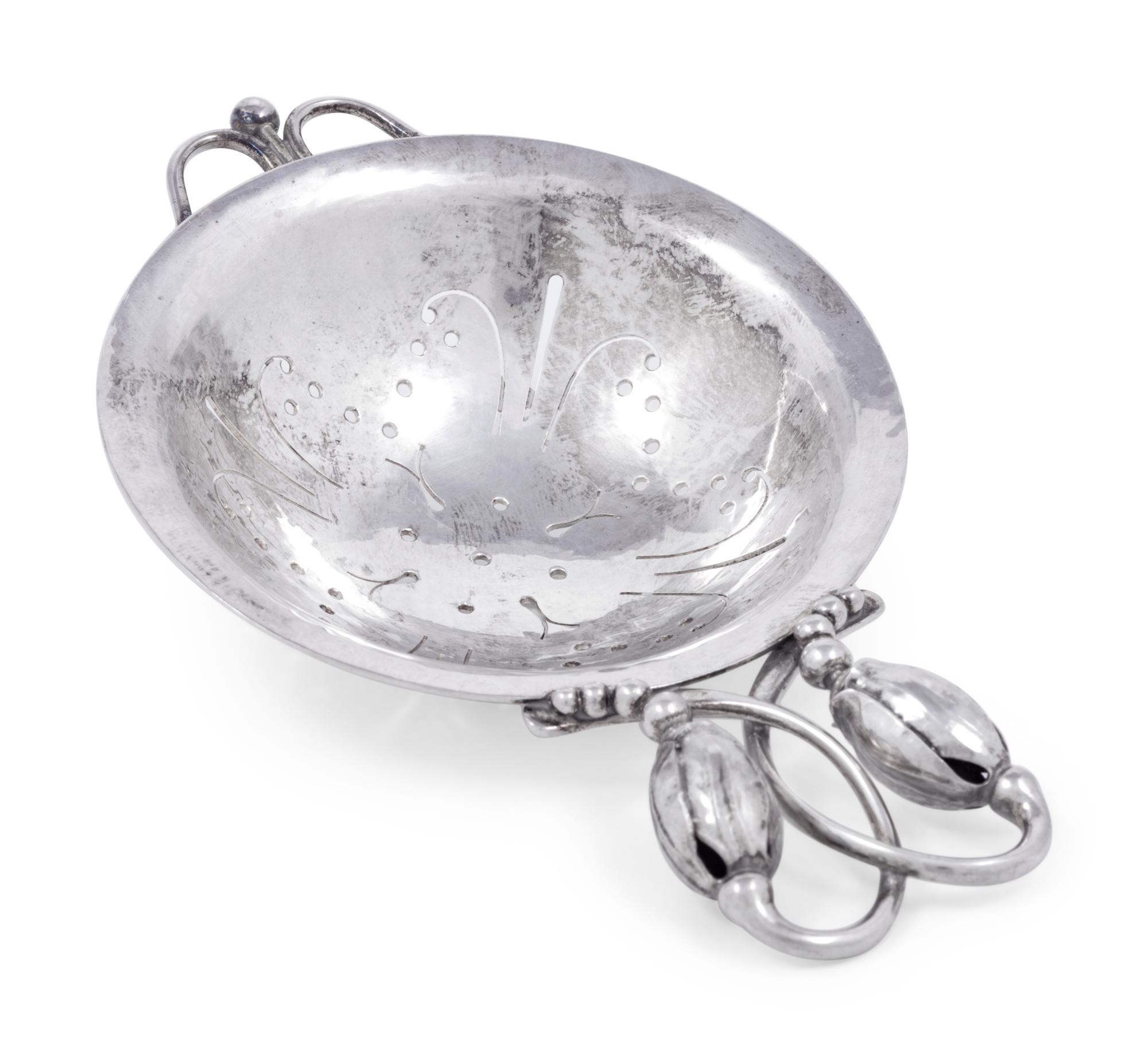 A Georg Jensen Silver Blossom Pattern Tea Strainer