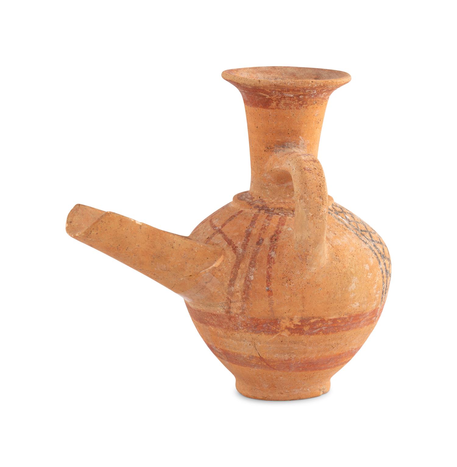 A Holy Land Pottery Spouted Strainer Jug