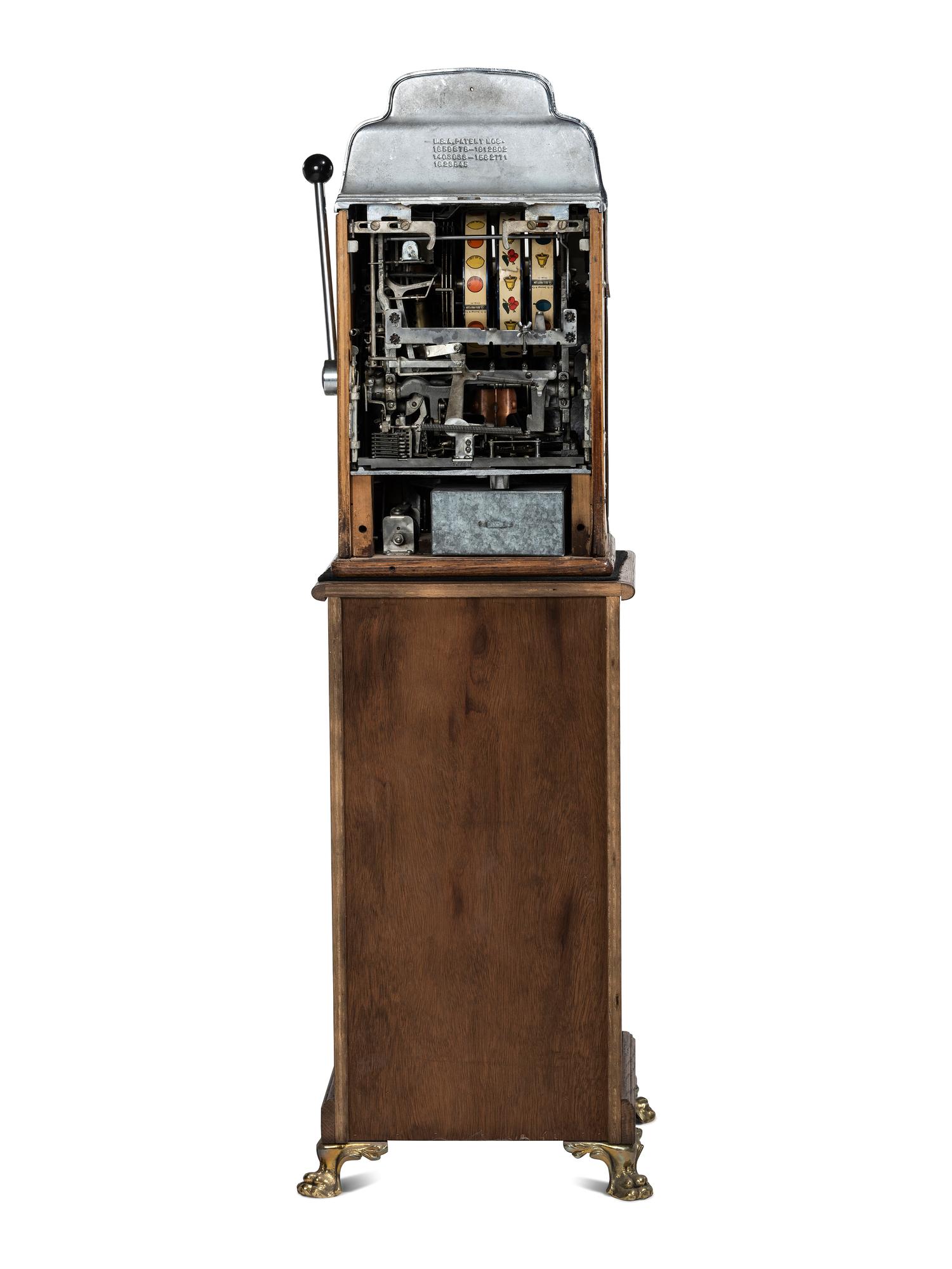 A Silver Dollar Standard Chief Slot Machine on Stand
