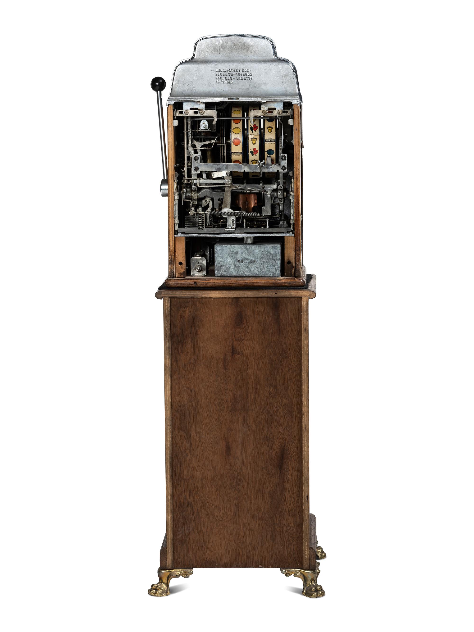 A Silver Dollar Standard Chief Slot Machine on Stand