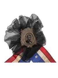 [LINCOLN, Abraham (1809-1865)]. Lincoln mourning cockade with ferrotype at center.