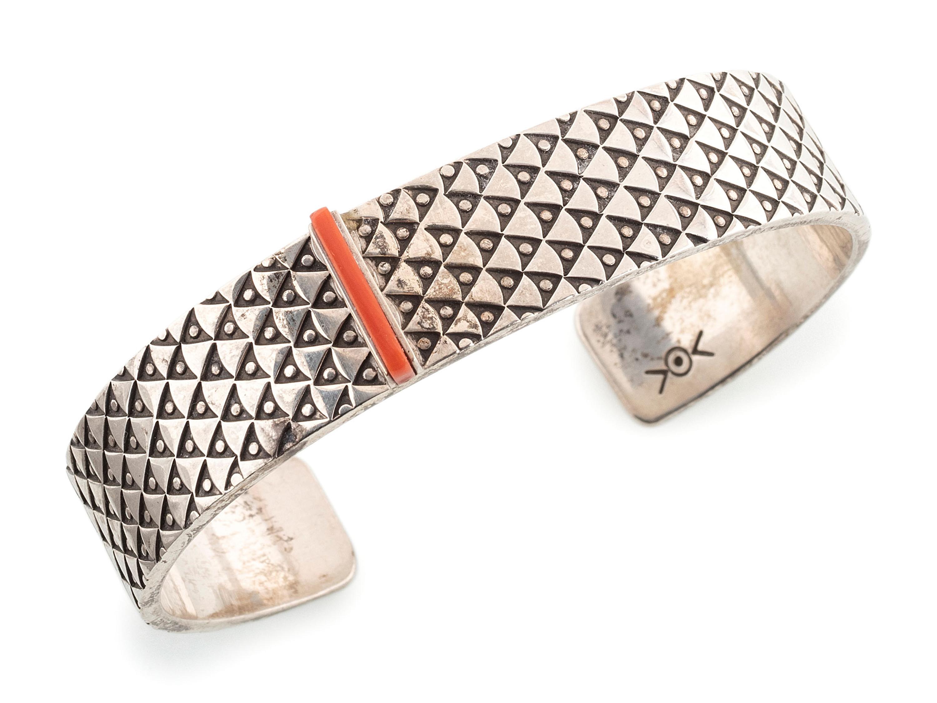Heavily Stamped Silver Cuff Bracelet, set with a Slender Coral Sliver