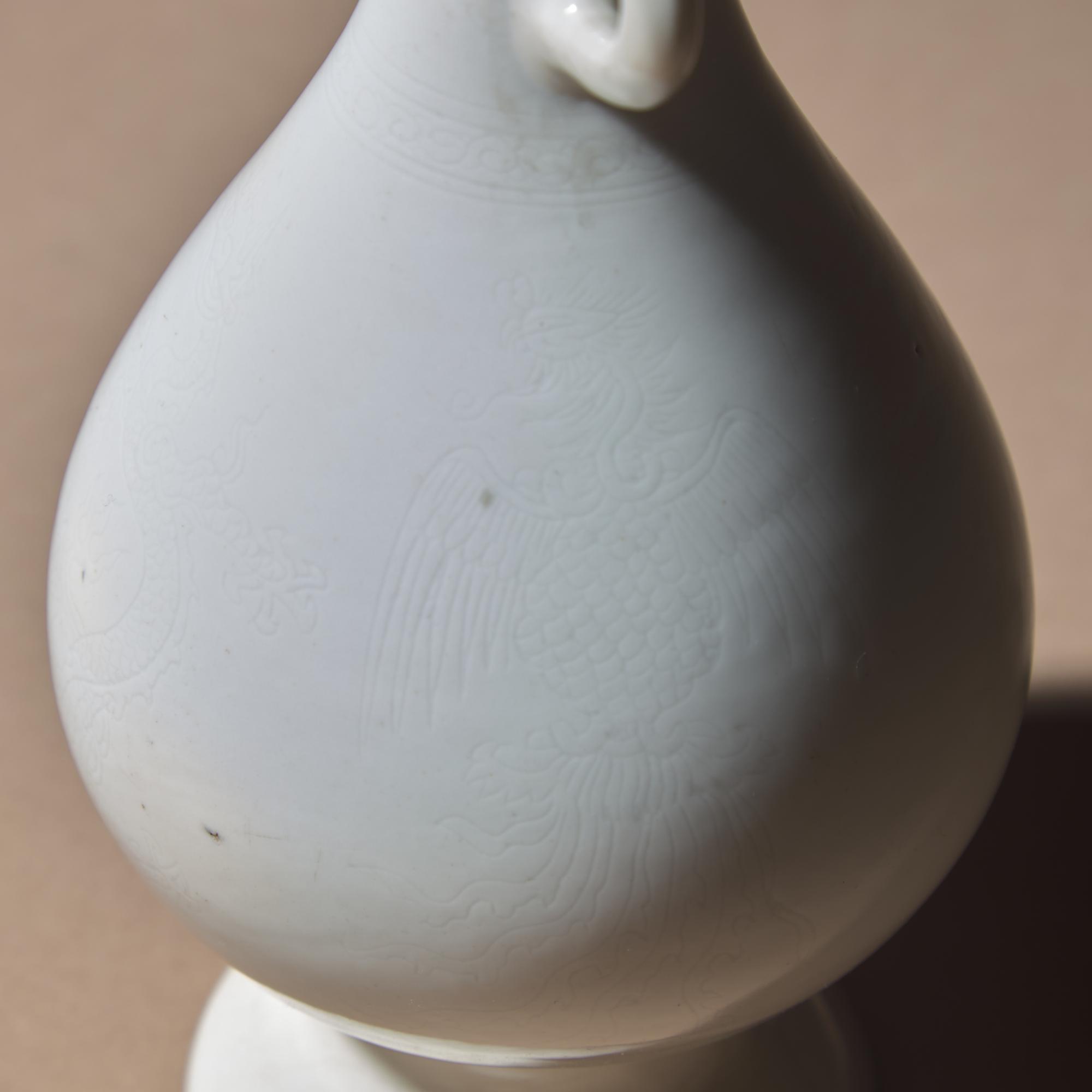 Two Chinese White Glazed Porcelain Vases, Qing Dynasty — 清 雙龍耳暗刻龍鳳紋白釉瓶及白釉四方小瓶