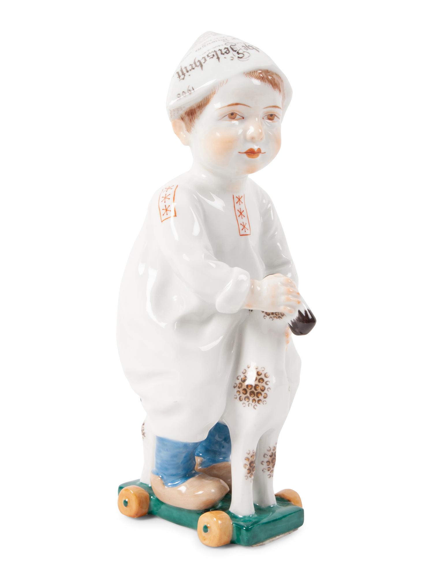 A Meissen Porcelain Figure of a Boy on a Pull Toy, by Konrad Hentschel