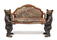 A Black Forest Style Settee Height 40 x width 61 x depth 18 inches. — MID-20TH CENTURY