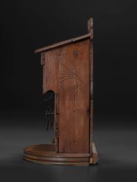 A Carved Wood Change Machine