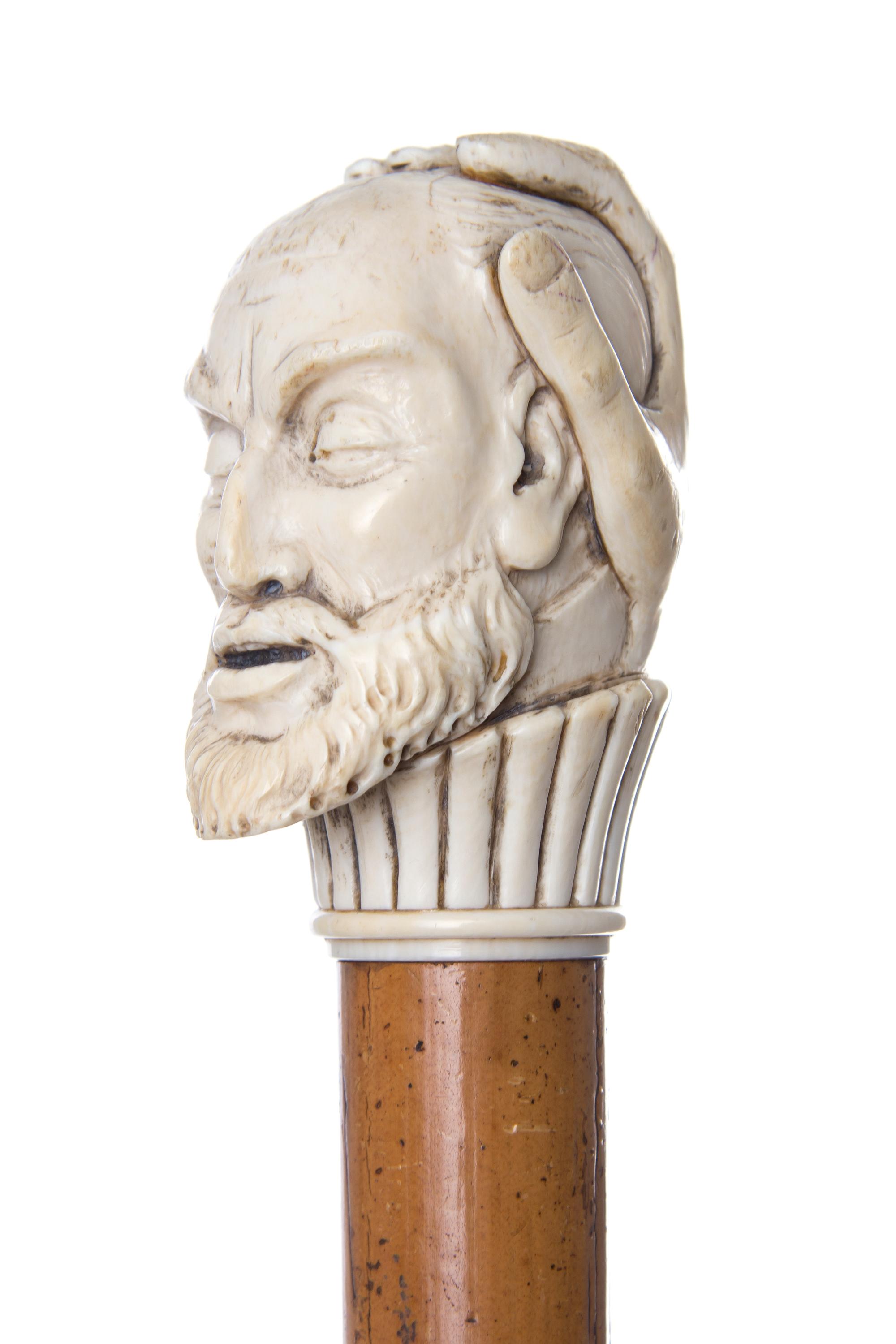 An English Ivory Handled Walking Stick, Length of handle 3 1/2 x length overall 36 7/8 inches.