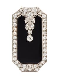 An Art Deco, Platinum, Diamond and Onyx Pendant/Clip Brooch, 11.00 dwts.