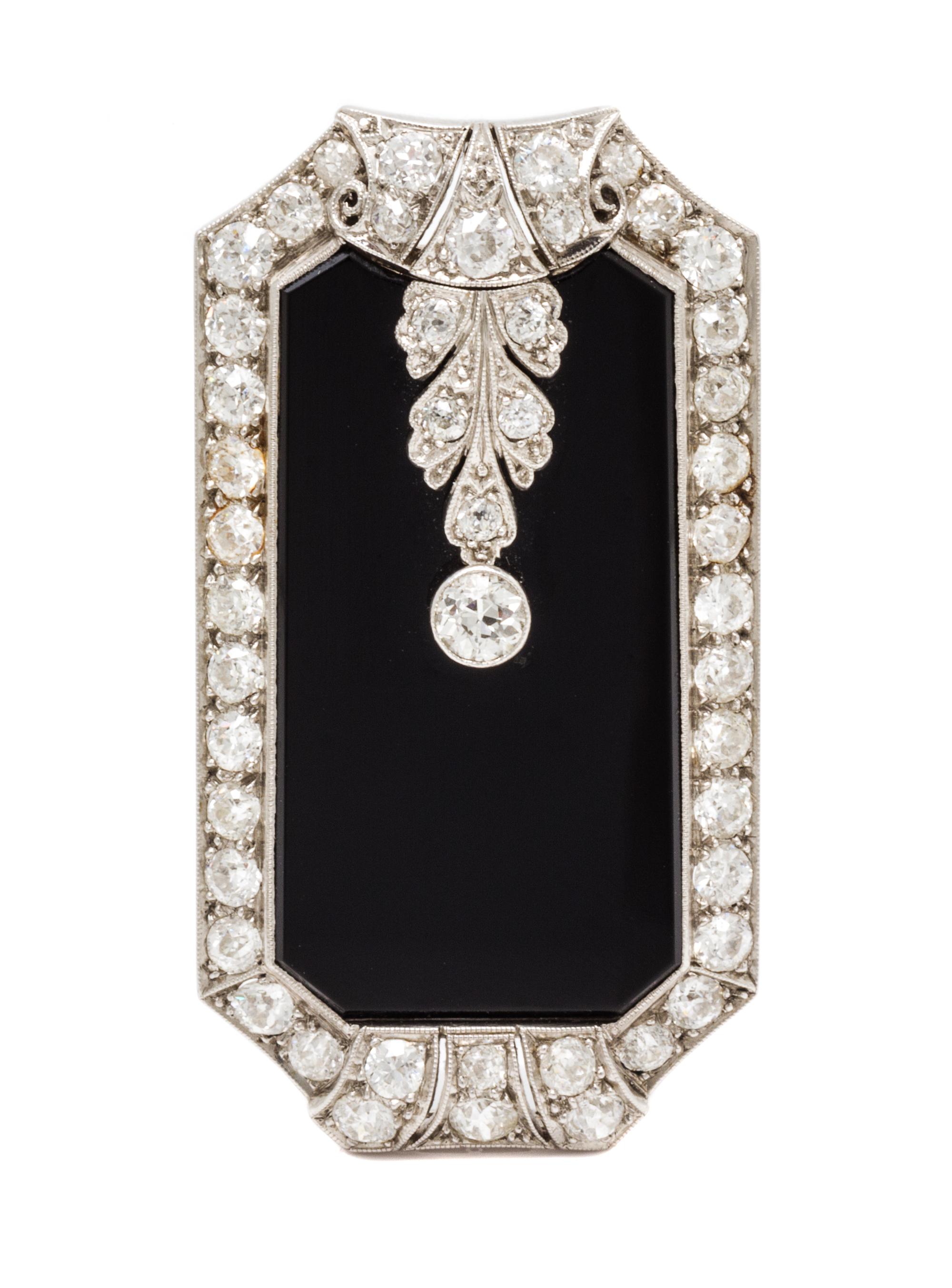 An Art Deco, Platinum, Diamond and Onyx Pendant/Clip Brooch, 11.00 dwts.