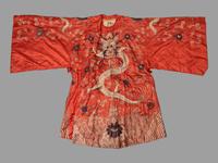 A Chinese Orange Ground Embroidered Silk Theatrical Dragon Robe