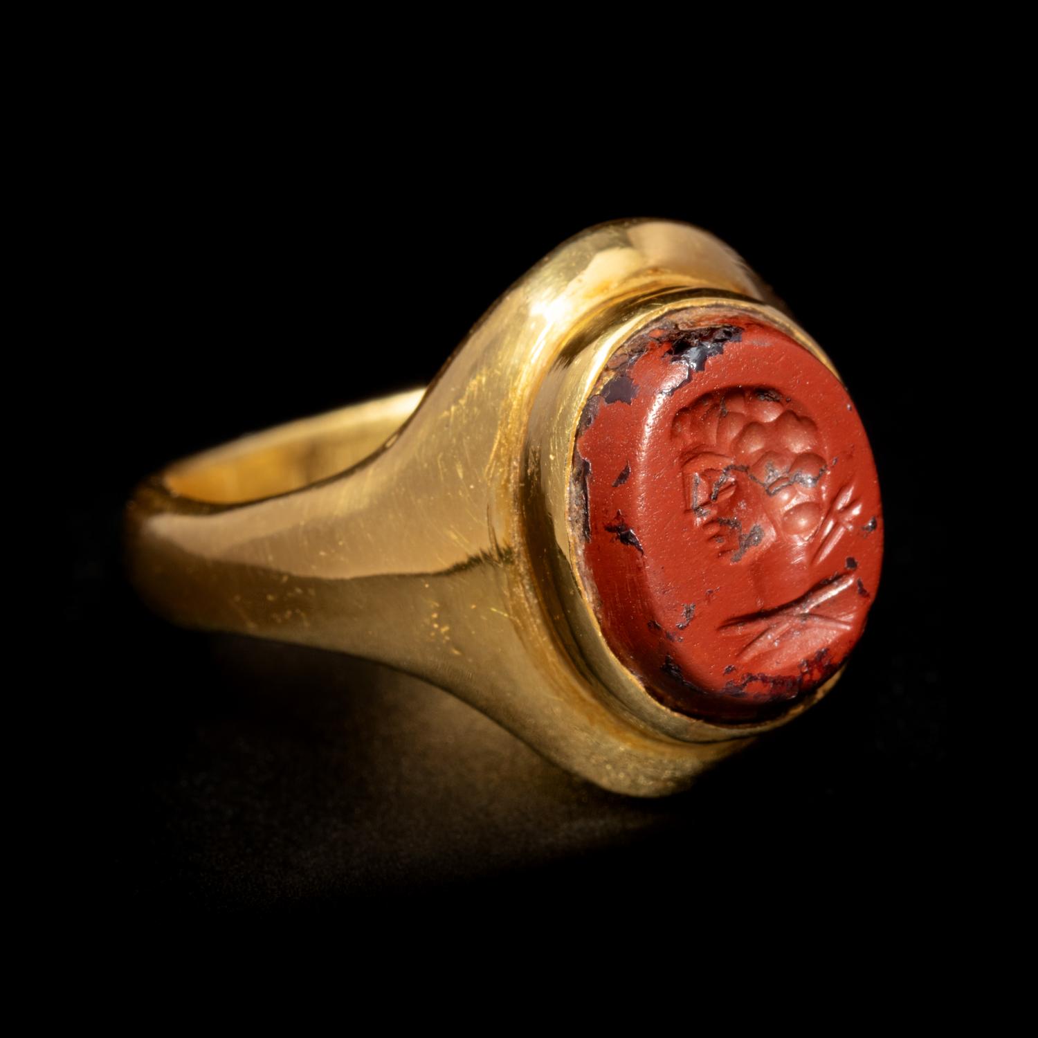 A Roman Gold and Red Jasper Finger Ring Engraved with the Bust of a Man