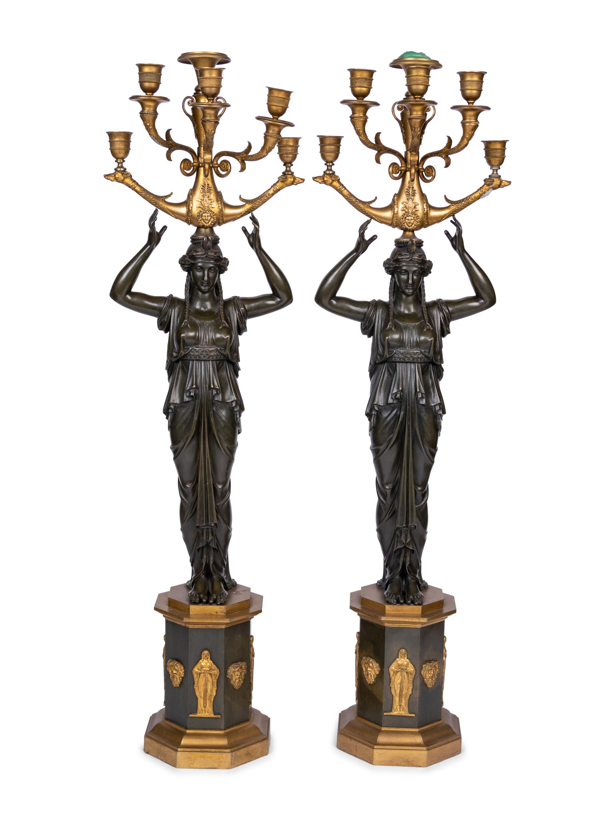 A Pair of Empire Style Gilt and Patinated Bronze Six-Light Figural Candelabra