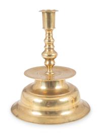 A Continental Brass Bell-Bottom Candlestick