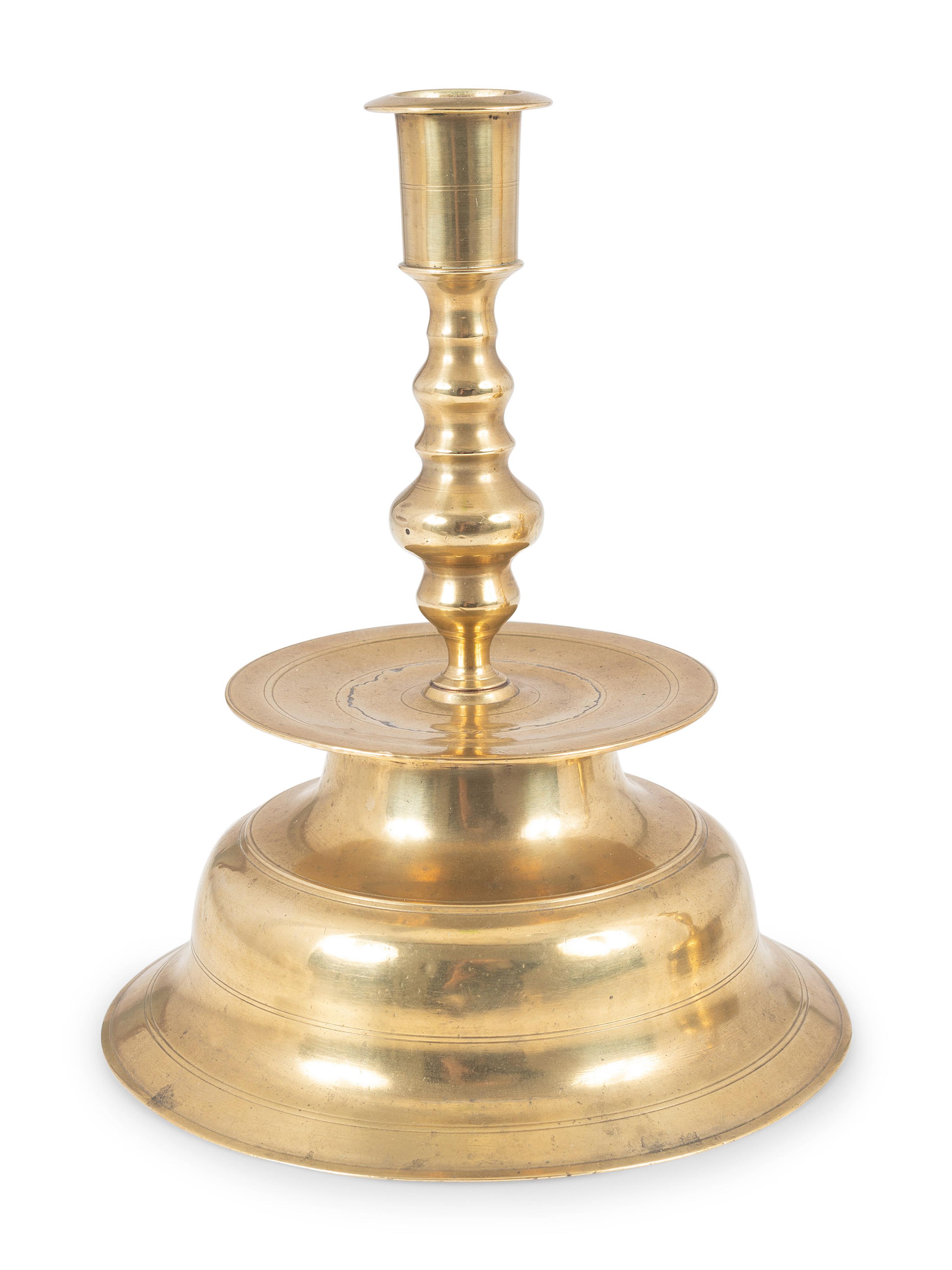 A Continental Brass Bell-Bottom Candlestick