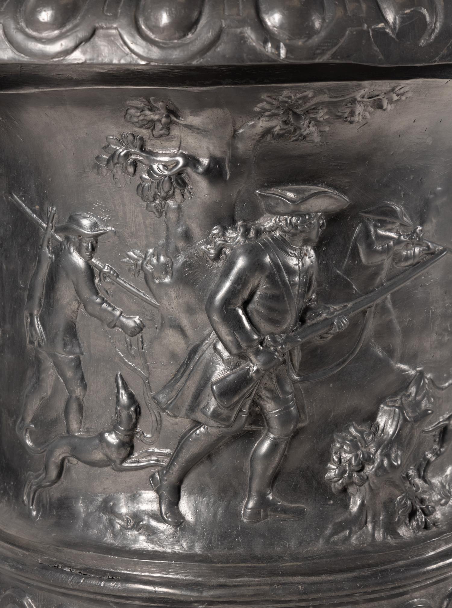A Pair of English Lead Allegorical Garden Urns