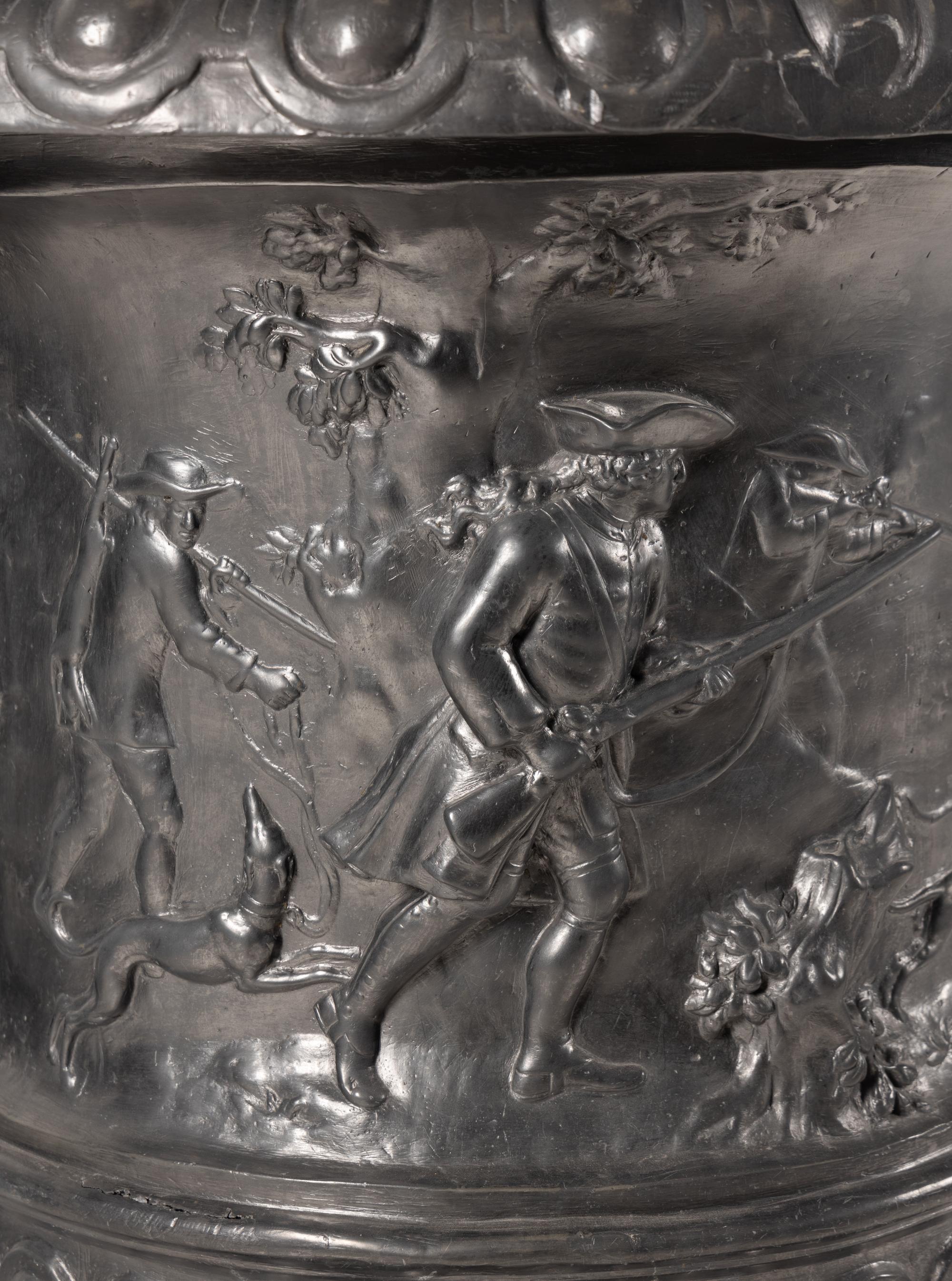 A Pair of English Lead Allegorical Garden Urns