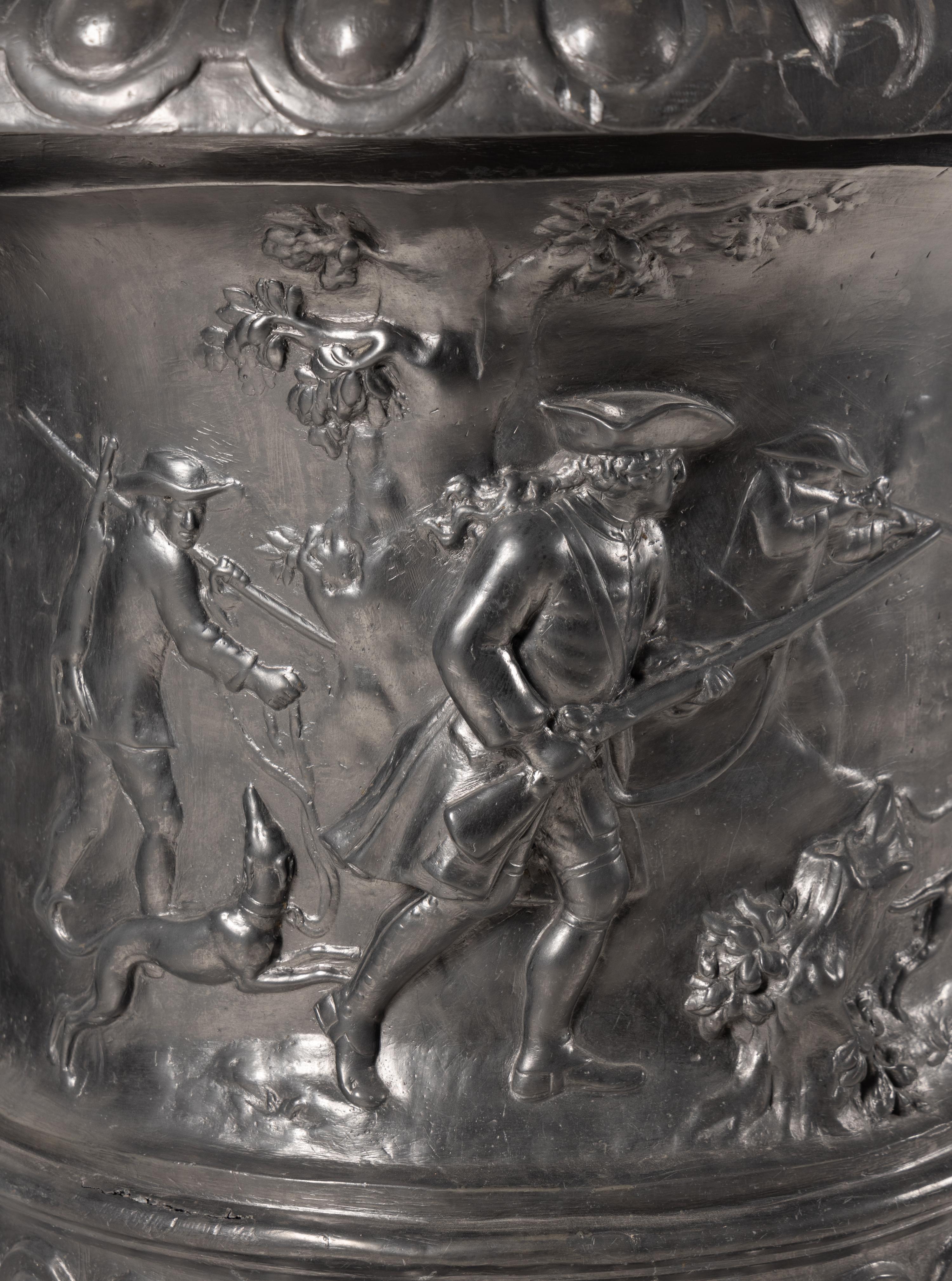 A Pair of English Lead Allegorical Garden Urns