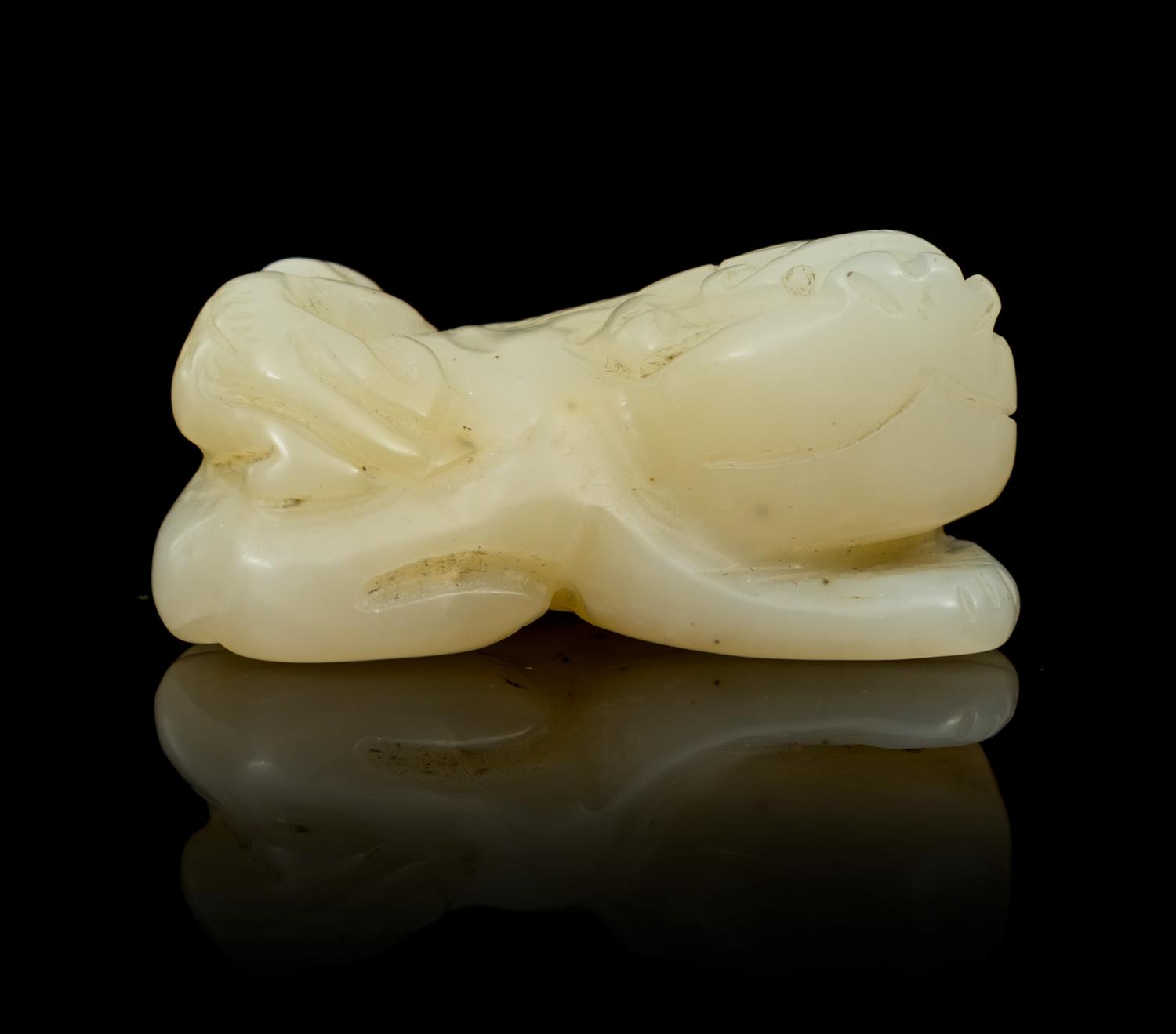 A Carved Jade Toggle Length 1 3/4 inches.