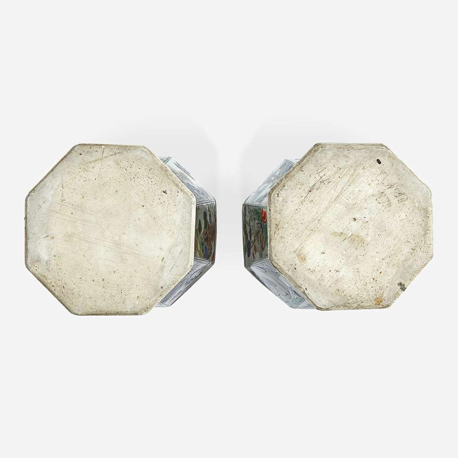 A pair of Chinese famille verte-decorated octagonal baluster vases and covers Kangxi period