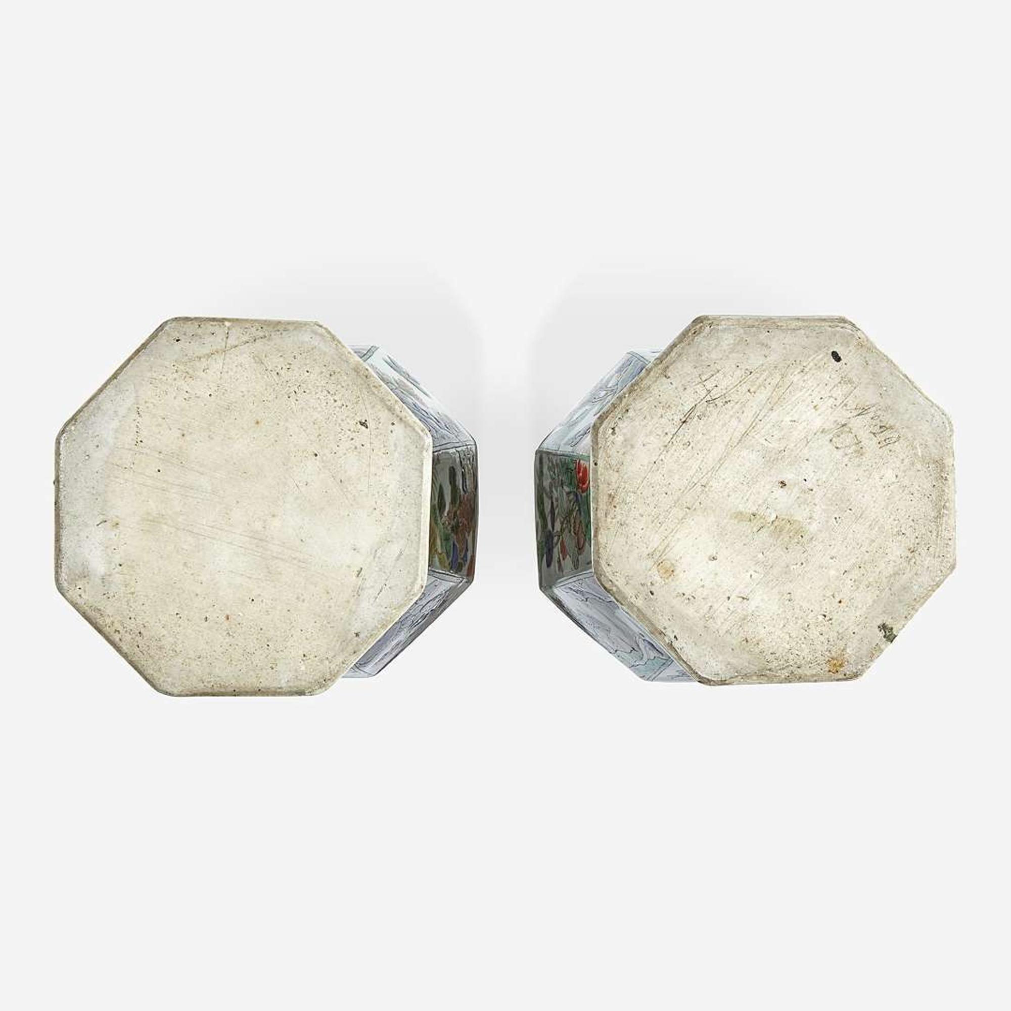 A pair of Chinese famille verte-decorated octagonal baluster vases and covers Kangxi period