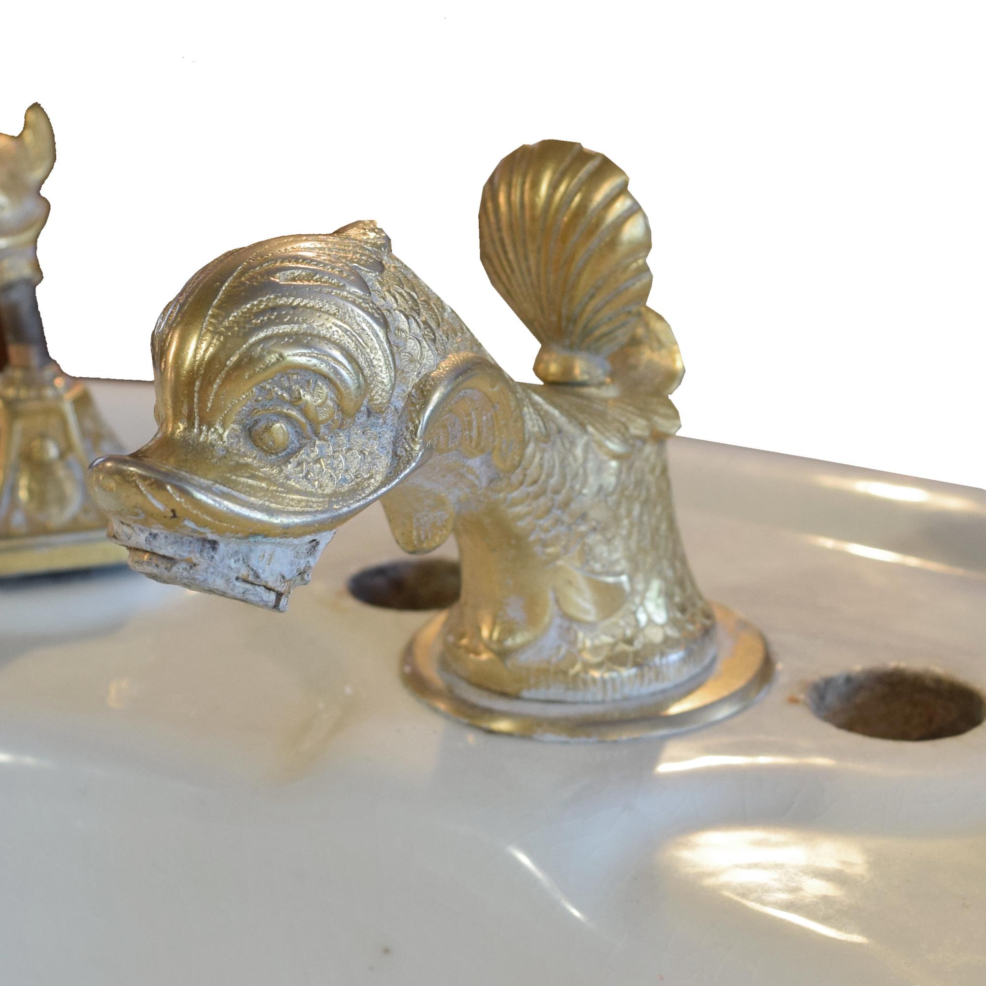 A Porcelain Pedestal Sink with Aquatic Hardware 37.5" W x 27.5" D x 32" H — United States, 20th Century