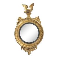A Classical Giltwood and Parcel Ebonized Bull's Eye Mirror with Eagle